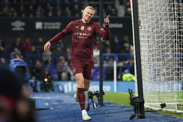 Manchester City's Erling Haaland celebrates scoring his side's 5th goal during the English Premier League soccer match between Ipswich Town and Manchester City at Portman Road stadium in Ipswich, England, Sunday, Jan. 19, 2025. (AP Photo/Ian Walton)