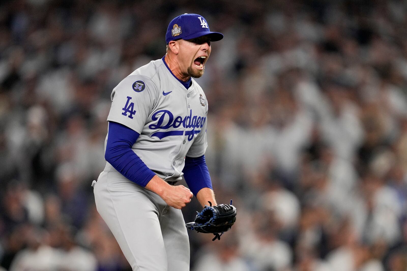 Los Angeles Dodgers pitcher Blake Treinen celebrates the end of the eighth inning in Game 5 of the baseball World Series against the New York Yankees, Wednesday, Oct. 30, 2024, in New York. (AP Photo/Ashley Landis)