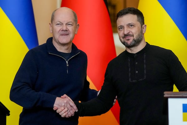 Ukraine's President Volodymyr Zelenskyy, right, and German Chancellor Olaf Scholz attend a press conference in Kyiv, Ukraine, Monday, Dec.2, 2024. (AP Photo/Evgeniy Maloletka)