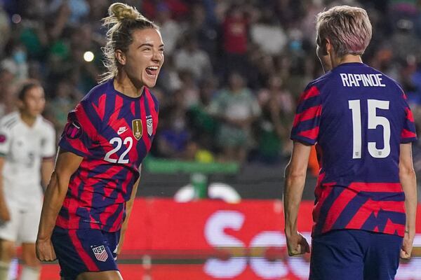 FILE - United States' Kristie Mewis, left, celebrates with Megan Rapinoe scoring the opening goal against Mexico during a CONCACAF Women's Championship soccer match in Monterrey, Mexico, Monday, July 11, 2022. (AP Photo/Fernando Llano, File)