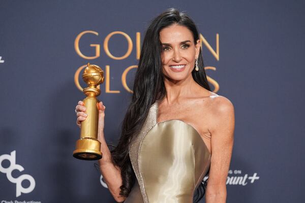 Demi Moore poses in the press room with the award for best performance by a female actor in a motion picture - musical or comedy for "The Substance" during the 82nd Golden Globes on Sunday, Jan. 5, 2025, at the Beverly Hilton in Beverly Hills, Calif. (AP Photo/Chris Pizzello)