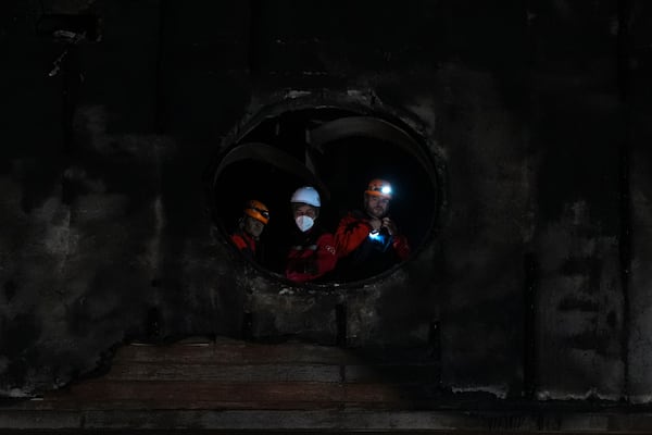 Firefighters and emergency teams work after a fire that broke out at a hotel in the ski resort of Kartalkaya, located in Bolu province, northwest Turkey, on Tuesday, Jan. 21, 2025. (AP Photo/Francisco Seco)