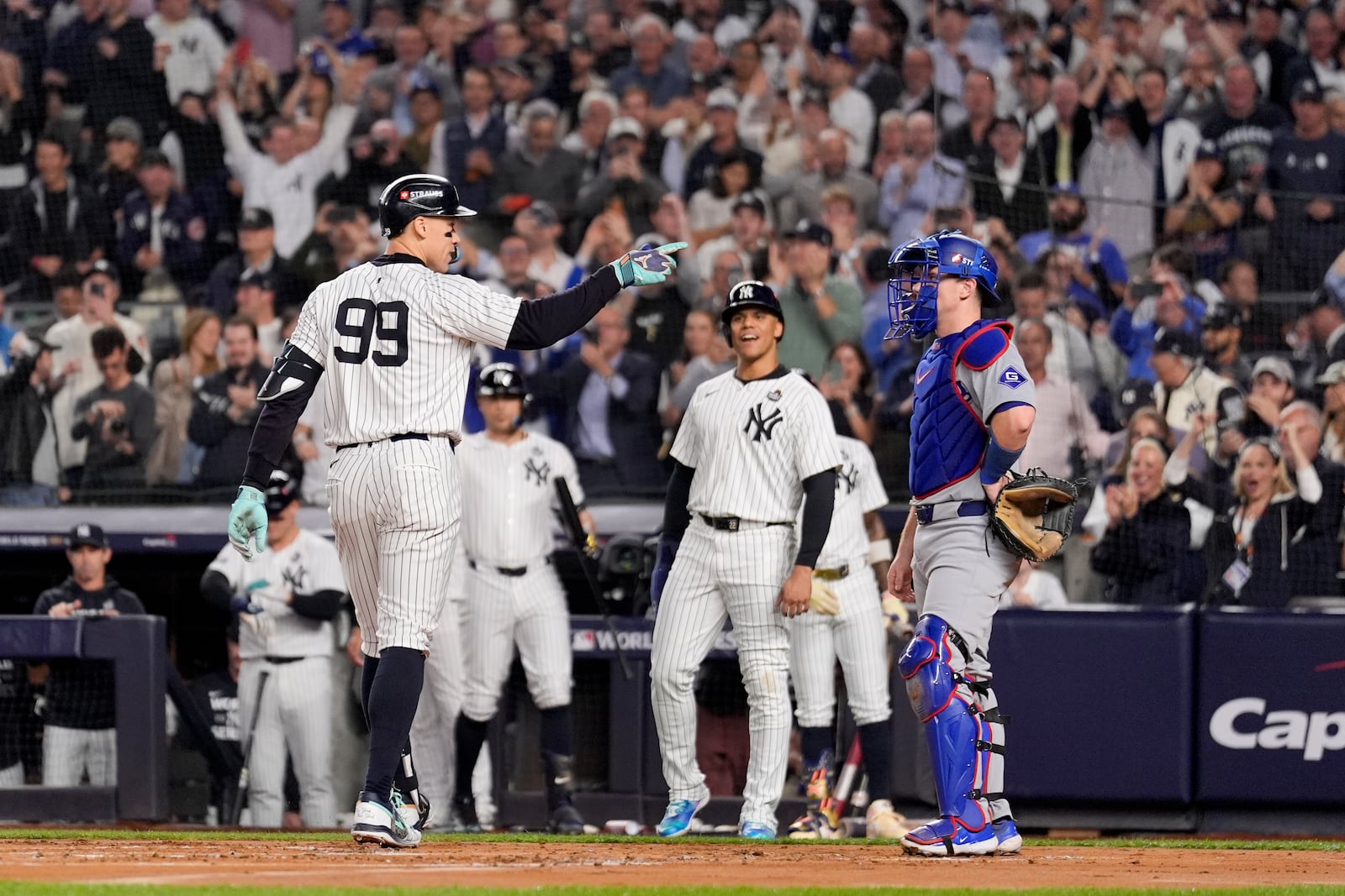 New York Yankees' Aaron Judge celebrates a two-run home run against the Los Angeles Dodgers during the first inning in Game 5 of the baseball World Series, Wednesday, Oct. 30, 2024, in New York. (AP Photo/Ashley Landis)