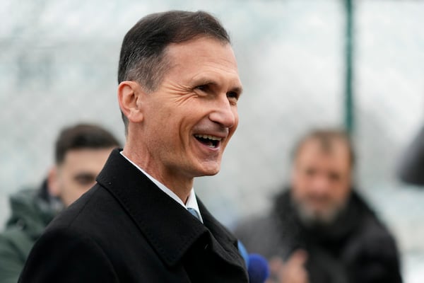 Presidential candidate Dragan Primorac talks to media during a runoff vote for the Croatian presidential election at a polling station in Zagreb, Croatia, Sunday, Jan. 12, 2025. (AP Photo/Darko Bandic)