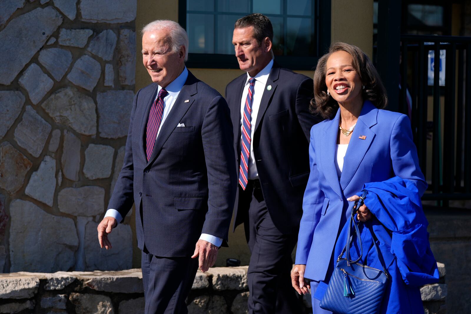 President Joe Biden, left, walks with Rep. Lisa Blunt Rochester, D-Del., after having breakfast at The Legend Restaurant & Bakery, Monday, Oct. 28, 2024, in New Castle, Del. (AP Photo/Manuel Balce Ceneta)