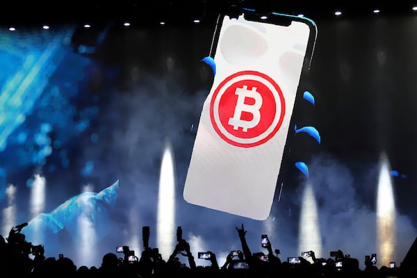 FILE - A bitcoin symbol is shown on an LED screen during the closing ceremony of a congress for cryptocurrency investors in Santa Maria Mizata, El Salvador, Nov. 20, 2021. (AP Photo/Salvador Melendez, File)