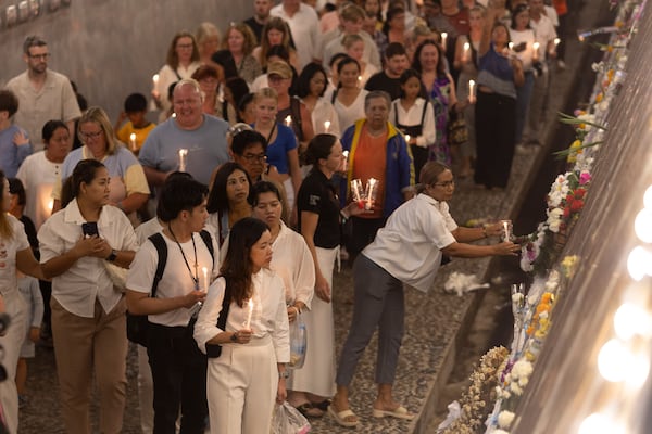 Relatives of victims of the 2004 Indian Ocean tsunami hold a candle light vigil as they participate in the 20th anniversary, at Tsunami Memorial Park at Ban Nam Khem, Takuapa district of Phang Nga province, southern Thailand, Thursday, Dec. 26, 2024. (AP Photo/Wason Wanichakorn)