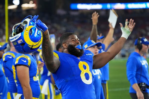 Los Angeles Rams linebacker Jared Verse (8) celebrates a defensive stop against the Minnesota Vikings during the second half of an NFL wild card playoff football game, Monday, Jan. 13, 2025, in Glendale, Ariz. (AP Photo/Ross D. Franklin)