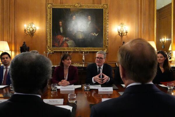 FILE - Britain's Prime Minister Keir Starmer, center right, and Chancellor of the Exchequer Rachel Reeves, center left, host an investment roundtable discussion with BlackRock CEO Larry Fink, right, and members of the BlackRock executive board at 10 Downing Street in London, Thursday, Nov. 21, 2024. (AP Photo/Frank Augstein, Pool, File)