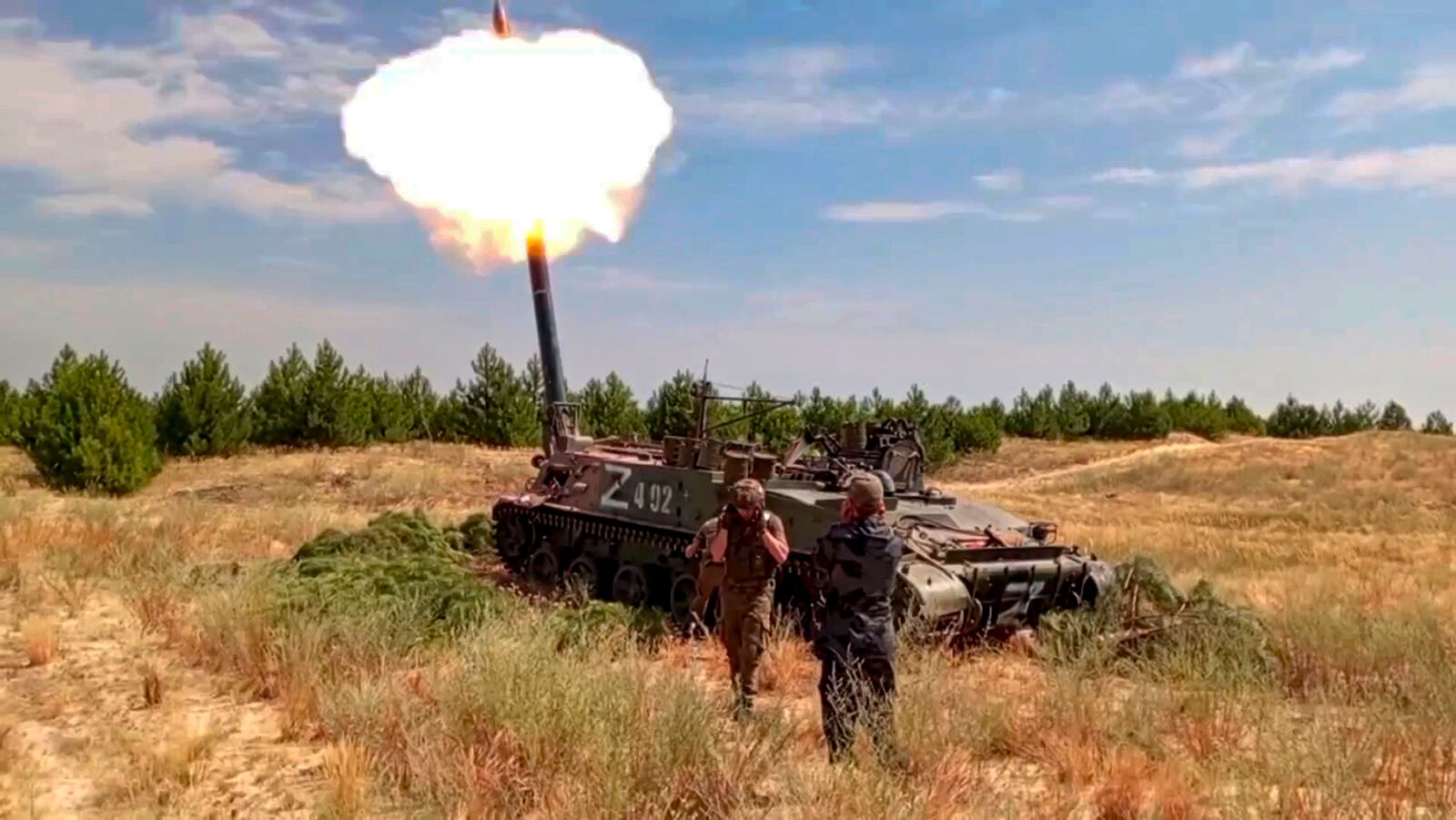 In this photo taken from video distributed by Russian Defense Ministry Press Service on Wednesday, Oct. 30, 2024, Russian soldiers fire a Tyulpan self-propelled heavy mortar from their position at an undisclosed location in Ukraine. (Russian Defense Ministry Press Service via AP)