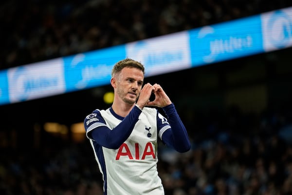 Tottenham's James Maddison celebrates after scoring his side's second goal during the English Premier League soccer match between Manchester City and Tottenham at the Etihad Stadium in Manchester, England, Sunday, Nov. 24, 2024. (AP Photo/Dave Thompson)