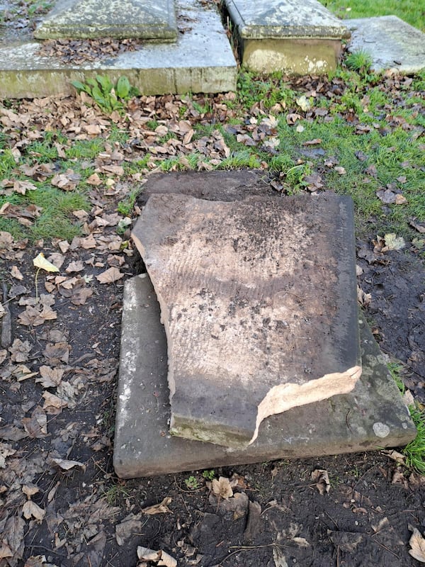 In this picture, provided by the West Mercia Police on Monday, Nov. 25, 2024, a smashed movie prop tombstone that was used for the "A Christmas Carol" movie is seen in Shrewsbury, England. (West Mercia Police via AP)