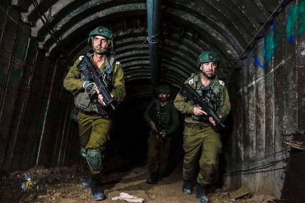 FILE - Israeli soldiers are seen in a tunnel that the military says Hamas militants used to attack the Erez crossing in the northern Gaza Strip, on Dec. 15, 2023. (AP Photo/Ariel Schalit, File)