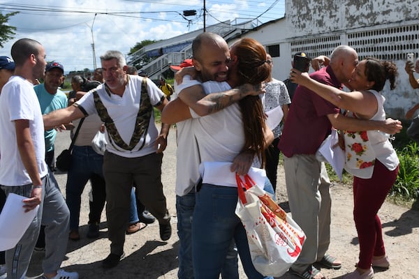 People detained during a government crackdown following anti-government protests against the results of the presidential election, are received by their relatives after their prison release in Tocuyito, Venezuela, Saturday, Nov. 16, 2024. (AP Photo/Jacinto Oliveros)