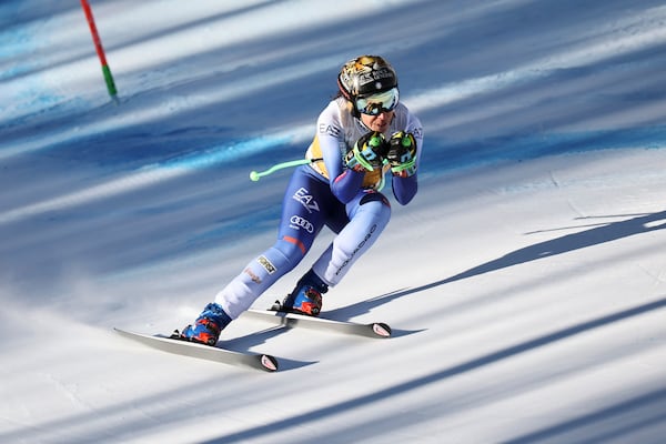 Italy's Federica Brignone speeds down the course during an alpine ski, women's World Cup downhill, in Cortina d'Ampezzo, Italy, Saturday, Jan. 18, 2025 (AP Photo/Marco Trovati)