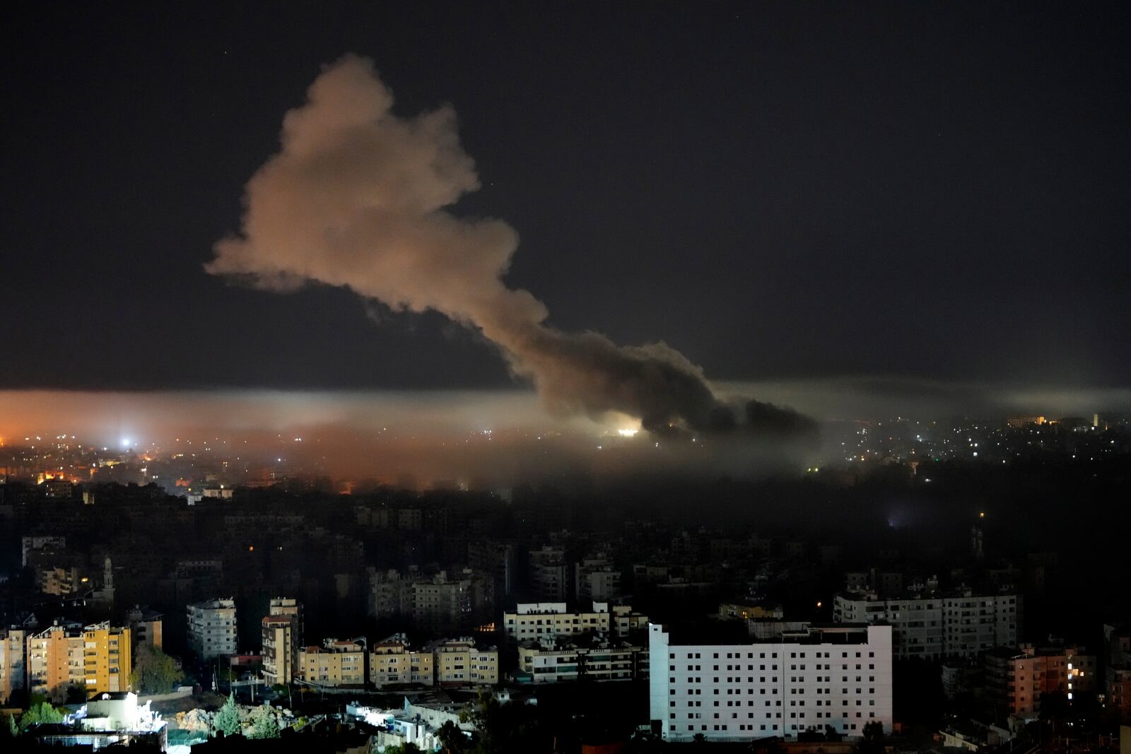 Smoke rises from an Israeli airstrike on Dahiyeh, in the southern suburb of Beirut, Lebanon, early Sunday, Oct. 27, 2024. (AP Photo/Hussein Malla)