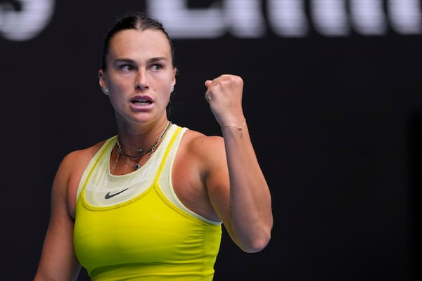 Aryna Sabalenka of Belarus reacts after winning a point against Jessica Bouzas Maneiro of Spain during their second round match at the Australian Open tennis championship in Melbourne, Australia, Wednesday, Jan. 15, 2025. (AP Photo/Vincent Thian)