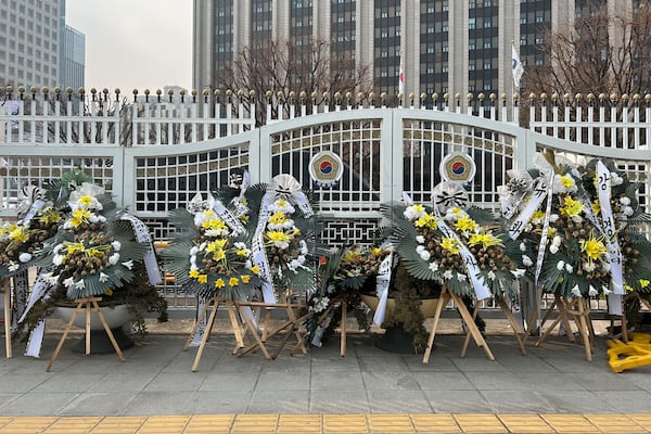 HOLD- Funeral wreaths bearing messages critical of officials involved in South Korea's martial law controversy stand outside the Government Complex Seoul on Monday, Jan. 20, 2025, in Seoul. (AP Photo/Juwon Park)