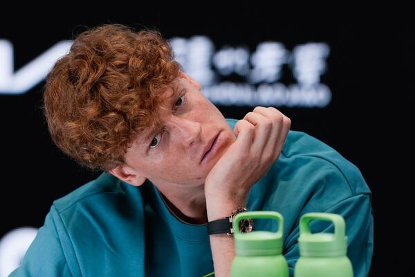 Italy's Jannik Sinner reacts during a press conference ahead of the Australian Open tennis championship in Melbourne, Australia, Friday, Jan. 10, 2025. (AP Photo/Ng Han Guan)