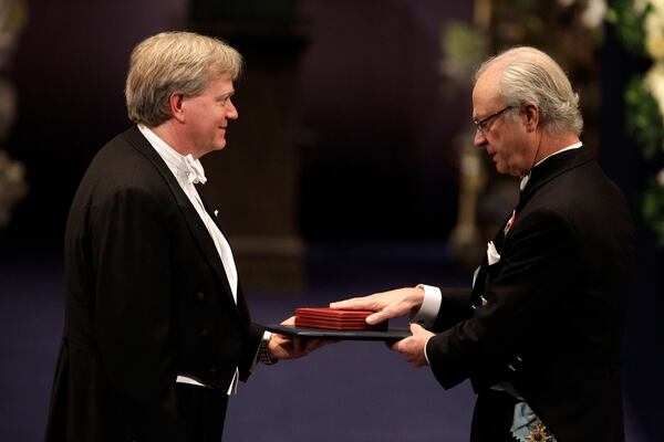 FILE - The 2011 Nobel Prize Laureate for Physics Dr Brian P. Schmidt from Australia receives his Nobel Prize from Sweden's King Carl XVI Gustaf, right, during the Nobel Prize award ceremony at the Stockholm Concert Hall in Stockholm, Sweden, Dec. 10, 2011. (AP Photo/Matt Dunham, File)