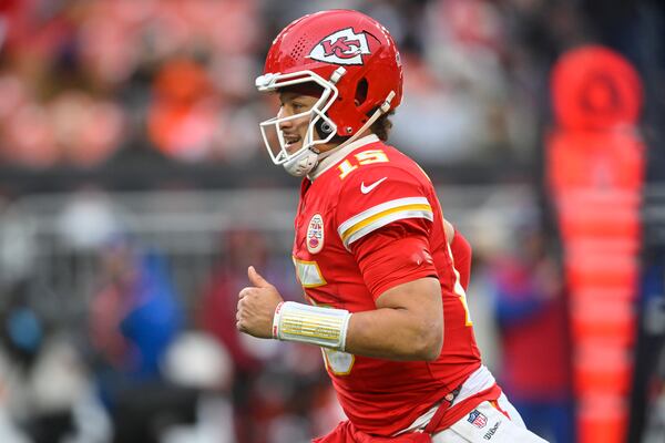 Kansas City Chiefs quarterback Patrick Mahomes (15) celebrates a touchdown against the Cleveland Browns during the second half of an NFL football game, Sunday, Dec. 15, 2024, in Cleveland. (AP Photo/David Richard)