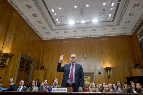 Russell Vought, President-elect Donald Trump's nominee to be Director, Office of Management and Budget, is sworn-in during a Senate Committee on Homeland Security and Governmental Affairs hearing for his pending confirmation on Capitol Hill, Wednesday, Jan. 15, 2025, in Washington. (AP Photo/Rod Lamkey, Jr.)