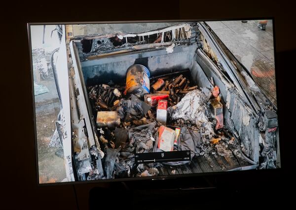 Items in the back of the Tesla Cybertruck which exploded in front of Trump International Hotel are shown in a video during an update to media at Metropolitan Police Department headquarters Wednesday, Jan. 1, 2025, in Las Vegas. (Chase Stevens/Las Vegas Review-Journal via AP)