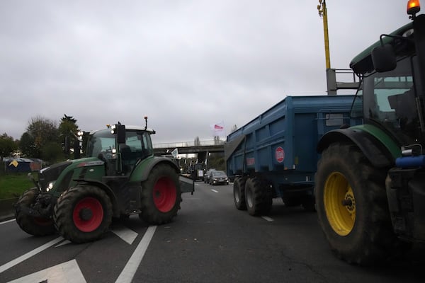 Farmers block a speedway to protest the EU-Mercosur trade agreement, Monday, Nov. 18, 2024 in Velizy-Villacoublay outside Paris. (AP Photo/Christophe Ena)