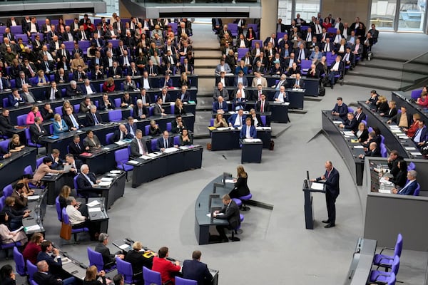 Friedrich Merz, German opposition leader and chairman of the Christian Democratic Union (CDU) party, speaks during a session of the German parliament 'Bundestag' in Berlin, Germany, Friday, Jan. 31, 2025. (AP Photo/Ebrahim Noroozi)