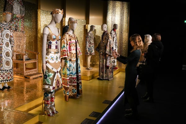 Creations are displayed during the exhibition "From the Heart to the Hands: Dolce&Gabbana" at the Grand Palais, in Paris, Thursday, Jan. 9, 2025. (AP Photo/Thibault Camus)