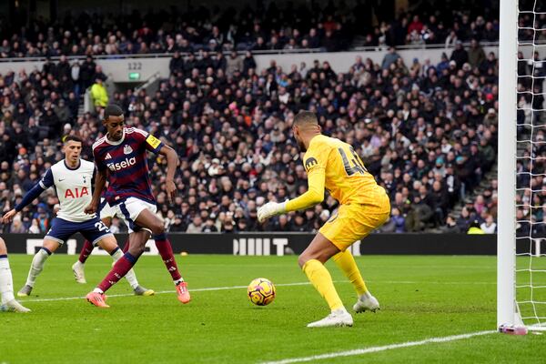 Newcastle United's Alexander Isak score past Tottenham's Brandon Austin during the English Premier League soccer match between Tottenham Hotspur and Newcastle United at the Tottenham Hotspur Stadium, London, Saturday Jan. 4, 2025. (John Walton/PA via AP)