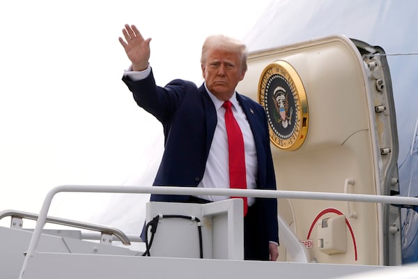 President Donald Trump waves as he boards Air Force One en route to Florida at Harry Reid International Airport in Las Vegas, Saturday, Jan. 25, 2025. (AP Photo/Mark Schiefelbein)