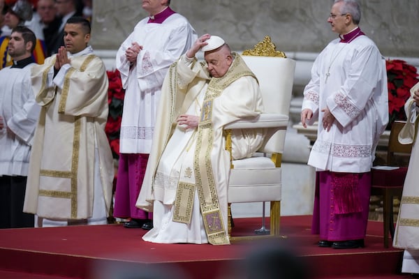 Pope Francis presides over the Christmas Eve Mass in St. Peter's Basilica at The Vatican, Tuesday, Dec. 24, 2024, after opening the basilica's holy door marking the start of the Catholic jubilar year 2025. (AP Photo/Andrew Medichini)