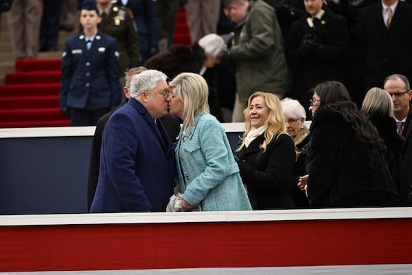 West Virginia Governor Patrick Morrisey kisses his wife, Denise, after speaking at his swearing-in at the state capitol in Charleston, W.Va., on Monday, Jan. 13, 2025. (AP Photo/Chris Jackson)