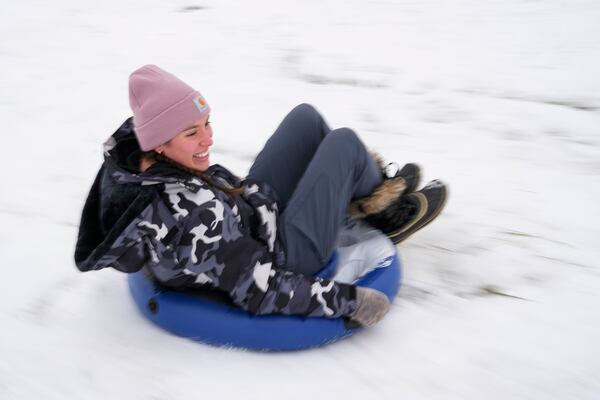 Rachael Morin sleds down a hill Saturday, Jan. 11, 2025, in Nashville, Tenn. (AP Photo/George Walker IV)