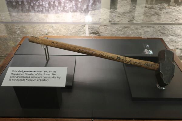 The sledgehammer used by the Republican Speaker of the House used to smash open a locked door to the chamber so that GOP members could enter and chase out Populist members who'd locked the Republicans out in what became known as the "Legislative War of 1893, is on display at the Statehouse, in Topeka, Kansas, Tuesday, Jan. 21, 2025. (AP Photo/John Hanna)