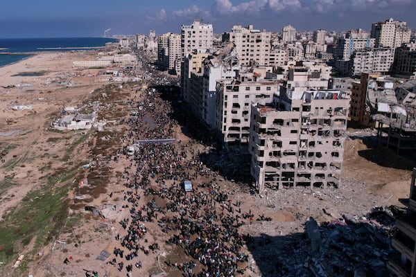 Displaced Palestinians return to their homes in the northern Gaza Strip on Monday, Jan. 27, 2025, following Israel's decision to allow thousands of them to go back for the first time since the early weeks of the 15-month war with Hamas. (AP Photo/Mohammad Abu Samra)