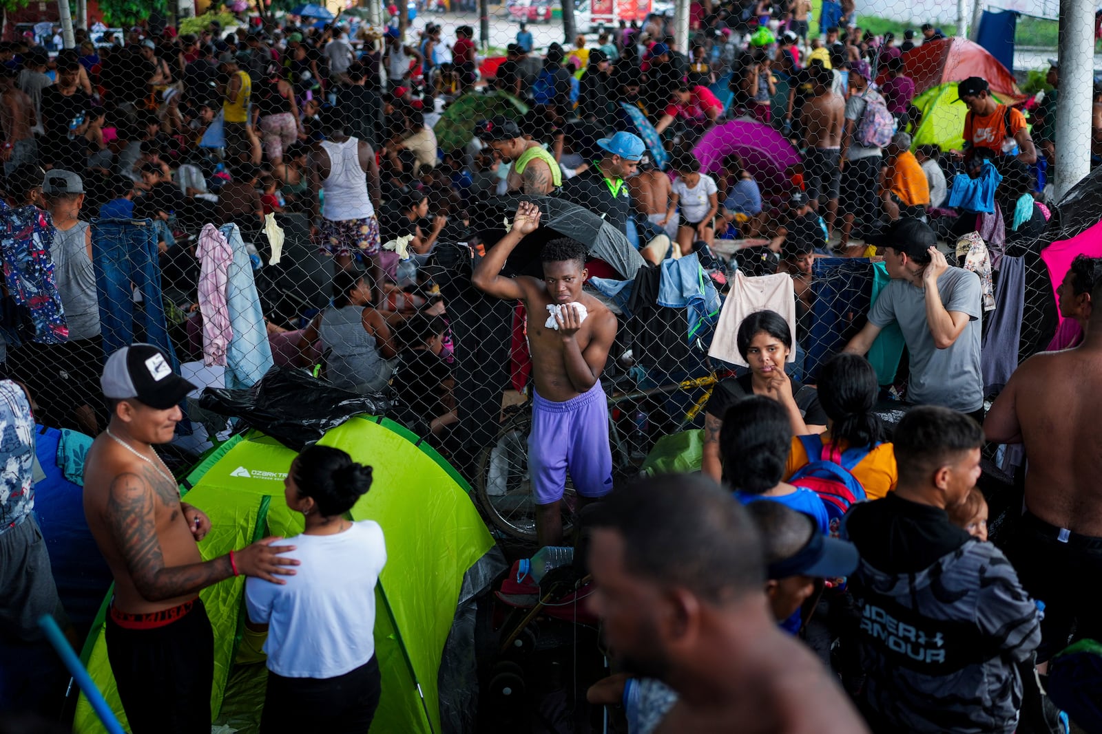 Migrants gather in a makeshift shelter in Huixtla, Chiapas state, Mexico, Wednesday, Nov. 6, 2024, hoping to reach the country's northern border and ultimately the United States. (AP Photo/Moises Castillo)