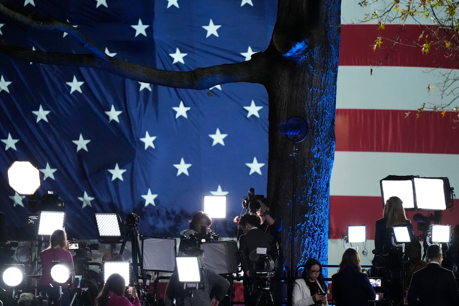 Members of the media work during an election night campaign watch party for Democratic presidential nominee Vice President Kamala Harris on Tuesday, Nov. 5, 2024, on the campus of Howard University in Washington. (AP Photo/Mark Schiefelbein)