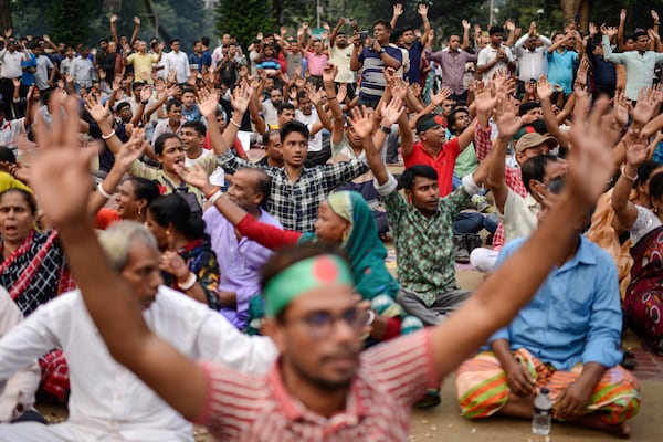 Bangladesh Hindus shout slogans during a protest rally to demand that an interim government withdraw all cases against their leaders and protect them from attacks and harassment in Dhaka, Bangladesh, Saturday, Nov. 2, 2024. (AP Photo/Mahmud Hossain Opu)