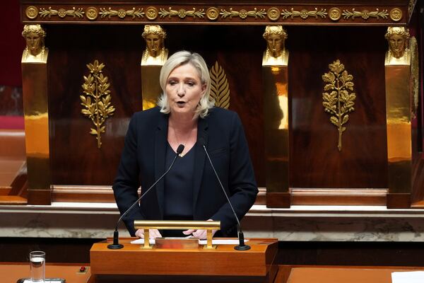 French far-right leader Marine Le Pen speaks at the National Assembly prior to a no-confidence vote that could bring down the Prime Minister and the government for the first time since 1962, Wednesday, Dec. 4, 2024 in Paris. (AP Photo/Michel Euler)