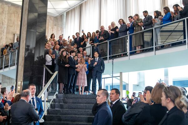 Secretary of State Marco Rubio speaks to State Department staff while next to his family, at the State Department, Tuesday, Jan. 21, 2025, in Washington. (AP Photo/Jacquelyn Martin)