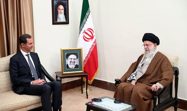 FILE - In this photo released by the official website of the office of the Iranian supreme leader, Supreme Leader Ayatollah Ali Khamenei, right, speaks with Syrian President Bashar Assad in a meeting in Tehran, Iran, May 30, 2024. (Office of the Iranian Supreme Leader via AP, File)