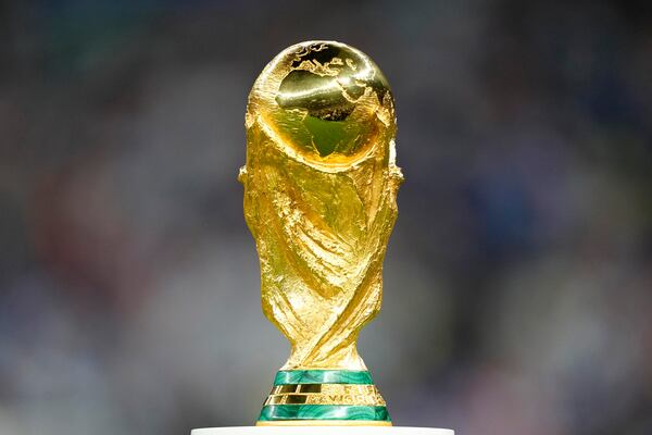 FILE - The trophy is displayed on the pitch ahead of the World Cup final soccer match between Argentina and France at the Lusail Stadium in Lusail, Qatar, Dec. 18, 2022. (AP Photo/Martin Meissner, File)