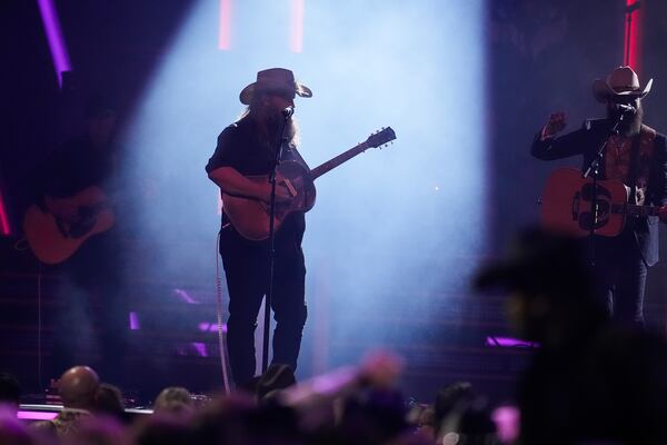 Chris Stapleton, left, and Post Malone perform "California Sober" during the 58th Annual CMA Awards on Wednesday, Nov. 20, 2024, at Bridgestone Arena in Nashville, Tenn. (AP Photo/George Walker IV)