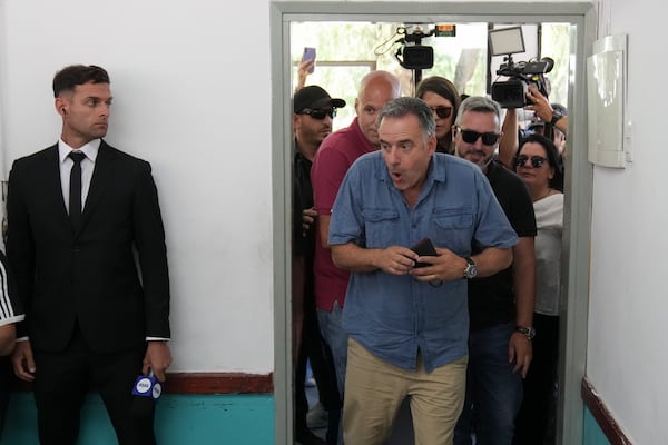 Yamandu Orsi, presidential candidate from the Broad Front, or Frente Amplio, arrives to vote in the presidential run-off election in Canelones, Uruguay, Sunday, Nov. 24, 2024. (AP Photo/Matilde Campodonico)