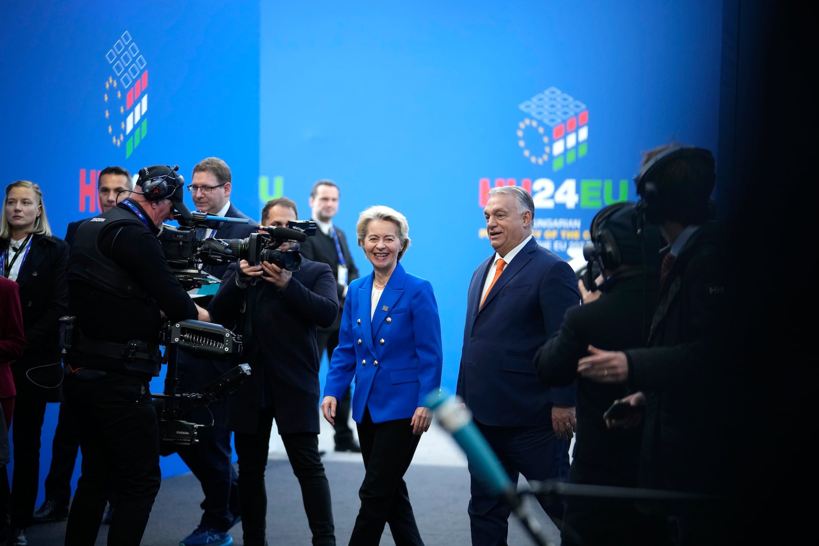 European Commission President Ursula von der Leyen, center, speaks with Hungary's Prime Minister Viktor Orban, right, as she arrives for an EU Summit at the Puskas Arena in Budapest, Hungary, Friday, Nov. 8, 2024. (AP Photo/Petr David Josek)