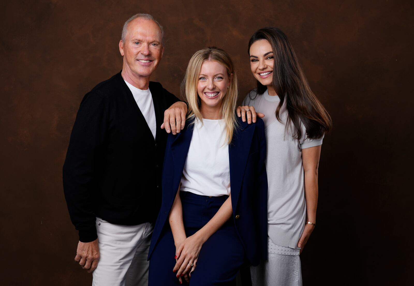 Hallie Meyers-Shyer, center, writer/director of "Goodrich," poses with cast members Michael Keaton, left, and Mila Kunis, Tuesday, Oct. 8, 2024, in Los Angeles. (AP Photo/Chris Pizzello)