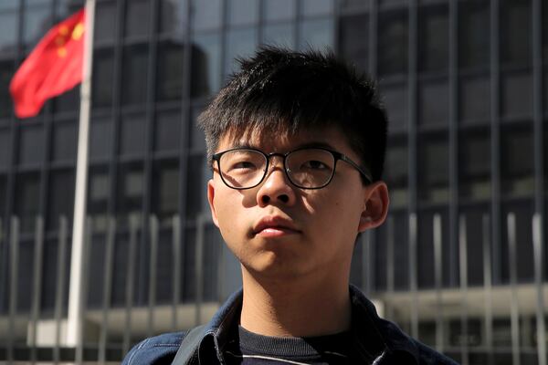 FILE - Pro-democracy activist Joshua Wong stands outside the Legislative Council building in Hong Kong on Nov. 28, 2019. (AP Photo/Kin Cheung, File)