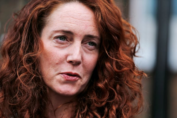 FILE - Rebekah Brooks, former News International chief executive, talks to members of the media in central London, Thursday, June 26, 2014. (AP Photo/Lefteris Pitarakis, File)